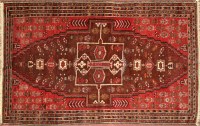 Lot 1307 - An Afgan Beluchi rug, floral motifs on red...
