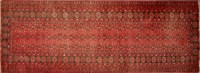 Lot 1309 - An Afgan runner, repeated floral motifs on red...