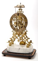 Lot 1347 - A brass skeleton clock, with roman chapter...