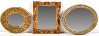 Lot 1360 - An early 19th Century oval wall mirror in gilt...