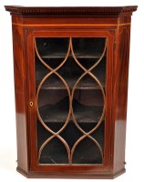 Lot 1395 - A Georgian mahogany hanging corner cabinet,...