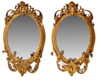 Lot 1398 - A pair of 19th Century oval gilt gesso wall...