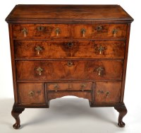 Lot 1406 - A walnut chest, with two short and two long...