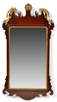 Lot 1409 - A George III parcel gilt mahogany wall mirror,...