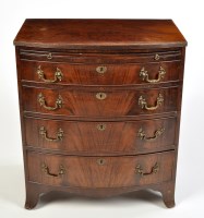 Lot 1410 - A mahogany bowfront chest of four long...