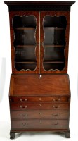 Lot 1413 - A George III mahogany bureau bookcase, with a...