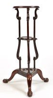 Lot 1424 - A mahogany Georgian style circular three-tier...