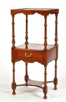 Lot 1437 - A walnut three-tier square-shaped bedside...