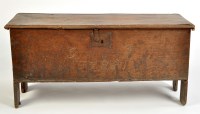 Lot 1467 - An early 18th Century elm coffer, with hinged...