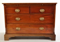 Lot 1483 - A late Georgian mahogany chest of two short...