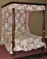 Lot 1504 - A four poster bed, with dentil cornice above...