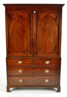 Lot 1514 - A George III gentleman's mahogany wardrobe,...