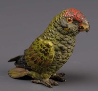 Lot 401 - A cold painted bronze Parakeet, green with red...