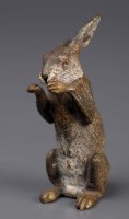 Lot 404 - A cold painted bronze Hare, standing on hind...