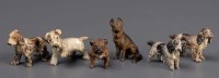 Lot 410 - Six cold painted bronze dogs, to include:...