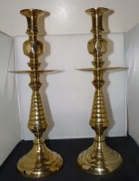 Lot 456 - A pair of 19th Century brass candlesticks, by...