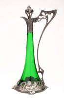 Lot 513 - An Art Nouveau WMF claret jug, of green glass...