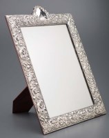 Lot 699 - An easel backed dressing table mirror, stamped...