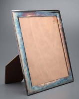 Lot 701 - A white metal easel backed photograph frame,...