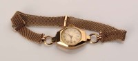 Lot 755 - A lady's 9ct. gold wristwatch, with circular...