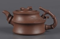 Lot 1002 - A Yixing teapot by Xu Yaqin, of bamboo form,...