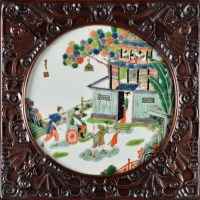 Lot 1006 - A circular Famille Vert plaque, painted with a...