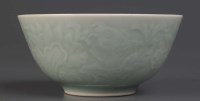 Lot 1020 - A carved Celadon bowl, late 19th Century, well...