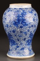 Lot 1026 - A blue and white vase, of baluster form...