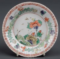 Lot 1029 - A Kangxi period famille vert saucer dish,...