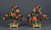 Lot 1035 - A pair of carved hardstone trees, fashioned as...