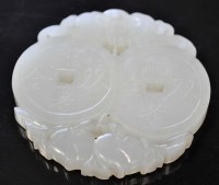 Lot 1044 - A white jade pendant, carved as two coins,...