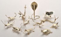 Lot 1063 - Twelve Oriental white metal insect and animal...