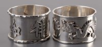 Lot 1064 - Two Chinese silver napkin rings, by Wang Hing,...