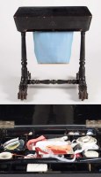 Lot 1065 - An Oriental black lacquered work table, the...