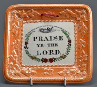 Lot 1116 - An orange lustre plaque, transfer printed with...