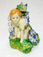 Lot 1120 - Royal Doulton: ''Fairy'' HN 1379, a crouching...