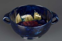 Lot 1143 - William Moorcroft: a footed twin-handled bowl,...