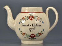 Lot 1147 - An 18th Century Cream ware teapot, with boldly...