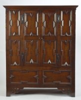 Lot 1214 - A Jacobean style oak armoir, with flared...