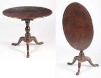 Lot 1217 - A George III circular mahogany tip-up-top...