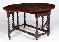 Lot 1222 - A 17th Century oak drop leaf gateleg dining...