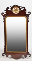 Lot 1227 - A George III mahogany parcel gilt wall mirror,...