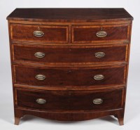 Lot 1228 - A Georgian mahogany bowfront chest of two...