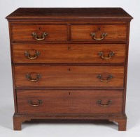 Lot 1230 - A Georgian mahogany chest of two short and...