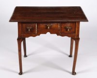 Lot 1231 - An early Georgian rectangular oak lowboy, with...