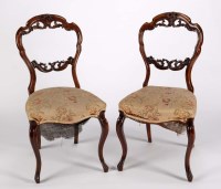 Lot 1232 - A set of four Victorian walnut balloon-back...