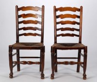 Lot 1241 - A 19th Century set of four elm ladder-back...