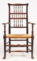 Lot 1253 - An early 19th Century elm rush seat open...