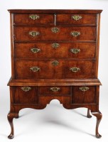 Lot 1267 - A walnut chest-on-stand, the upper section...