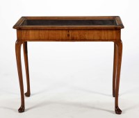 Lot 1308 - A walnut display table, the glazed rectangular...